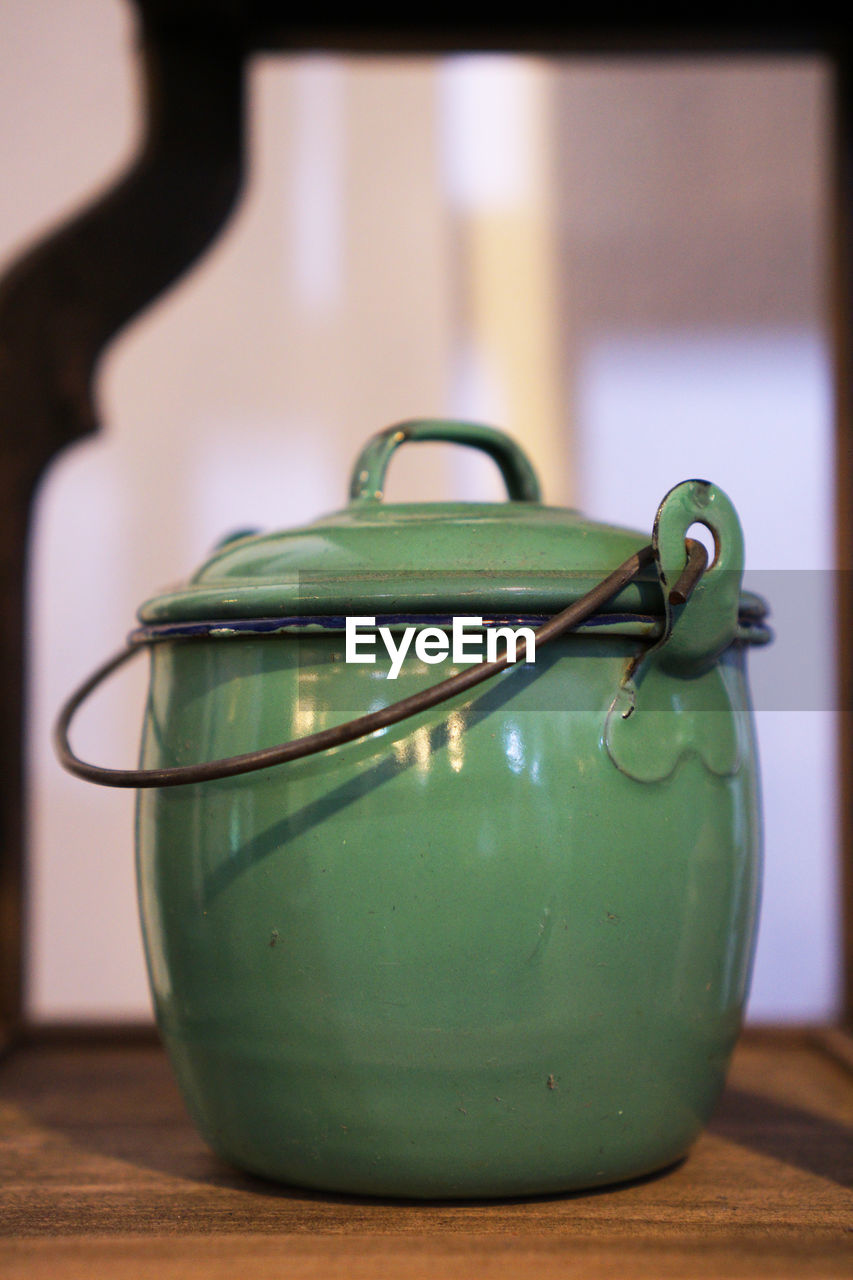 CLOSE-UP OF LEMON IN CONTAINER