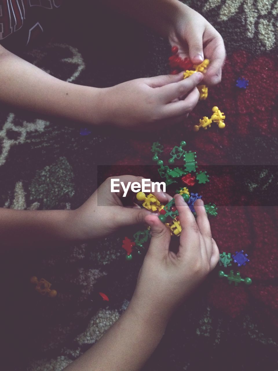 CLOSE-UP OF WOMAN HAND HOLDING MULTI COLORED CANDIES