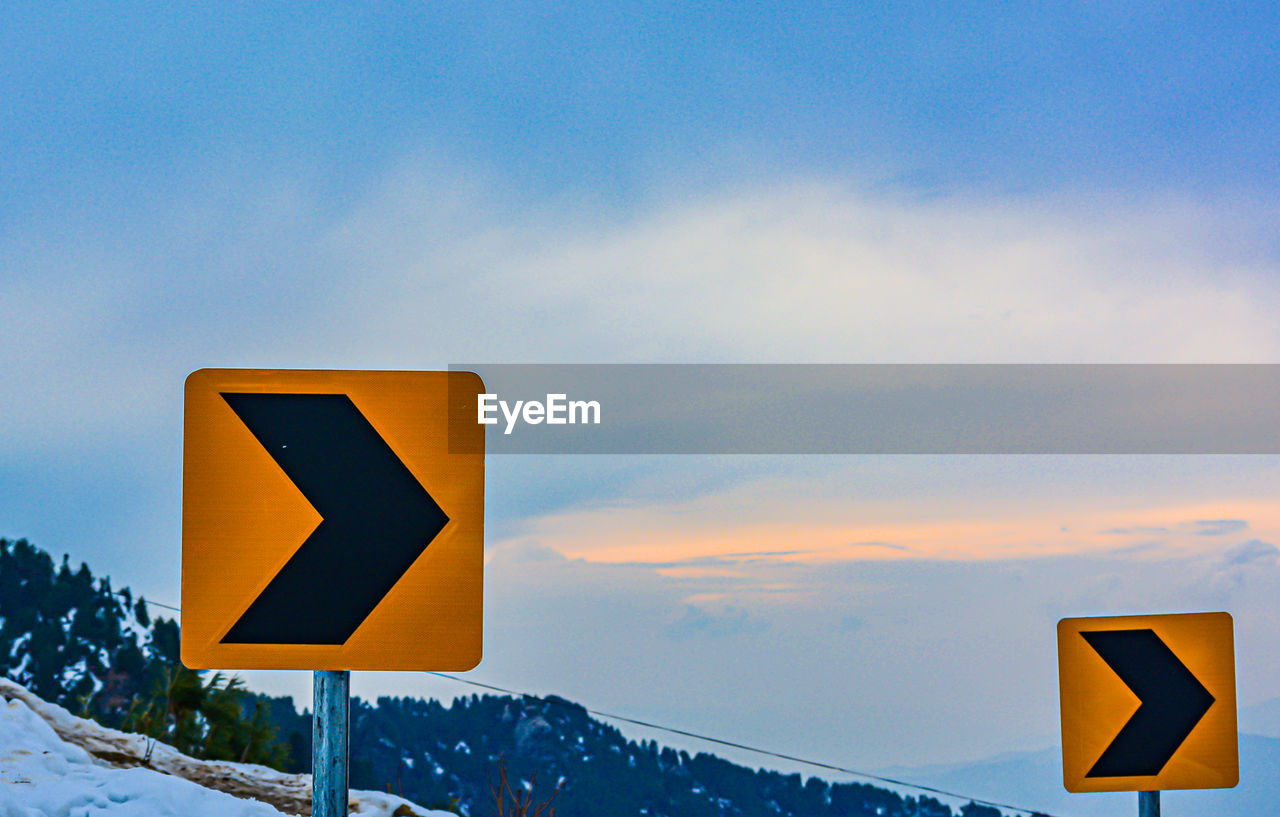 LOW ANGLE VIEW OF ROAD SIGN