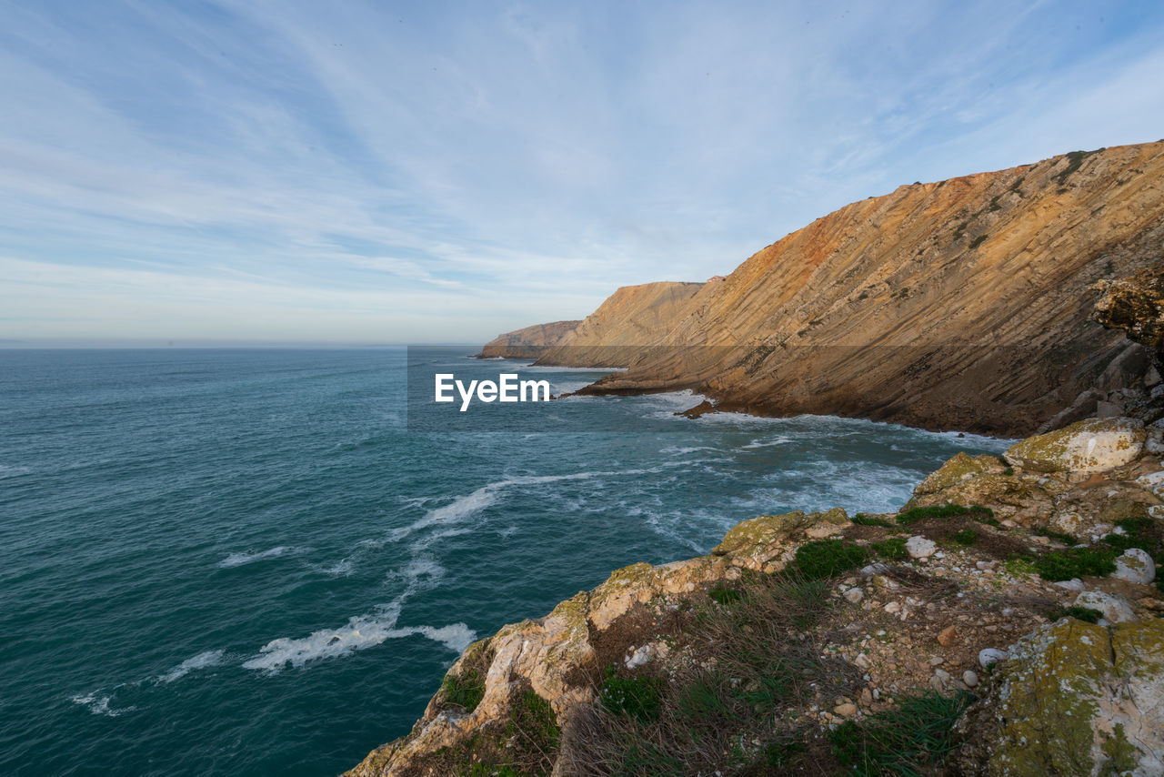 Sea cliffs landscape in cabo espichel at sunset, in portugal