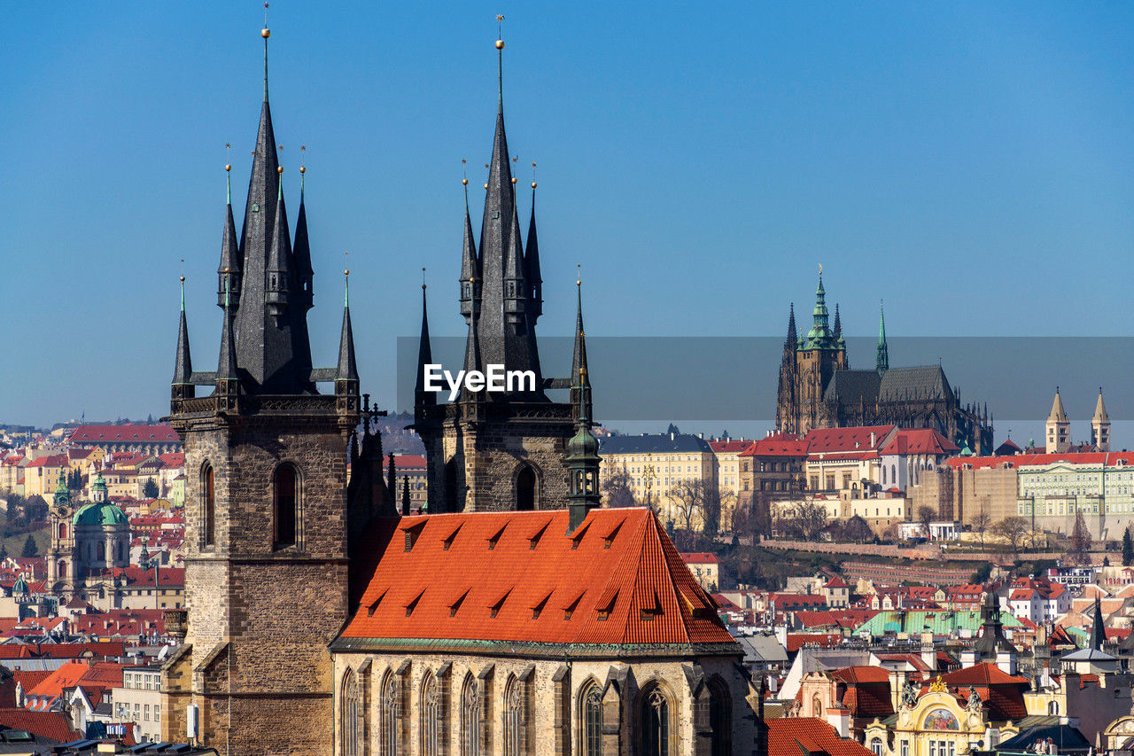 low angle view of buildings in city against clear sky