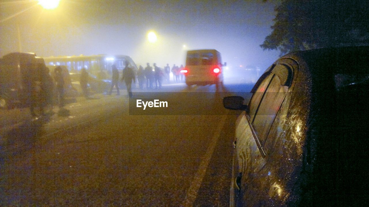 CARS ON ROAD DURING RAINY SEASON