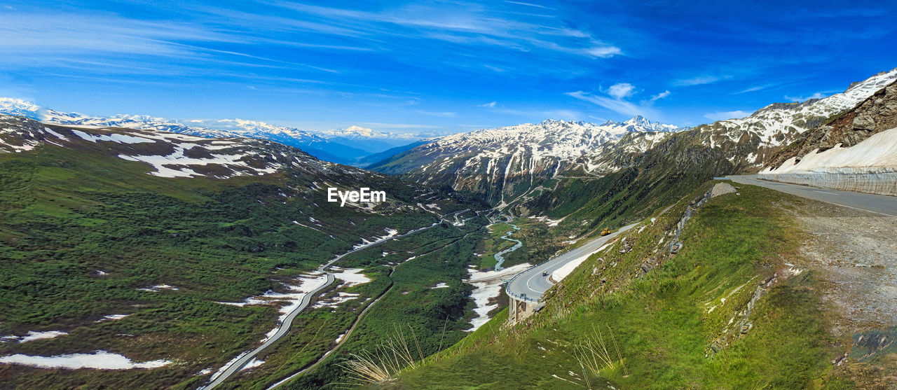 High angle view of snowcapped mountains against sky