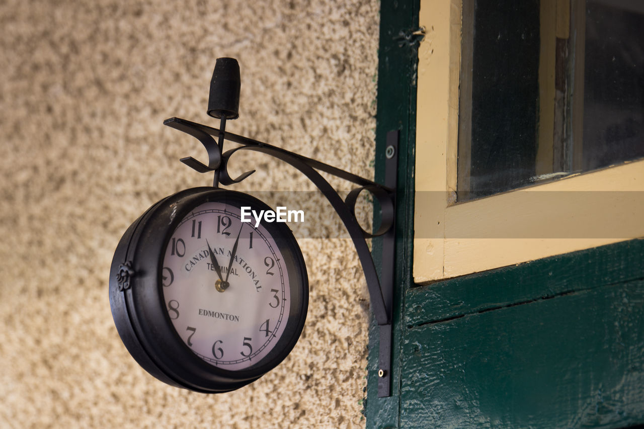 Close-up of clock on wall