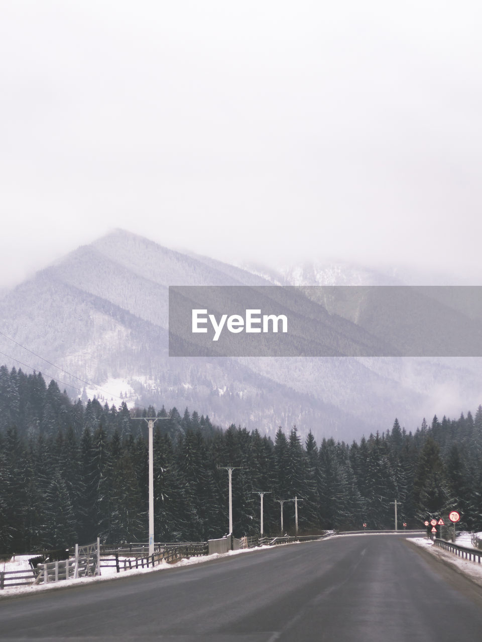 Scenic view of mountains against sky during winter