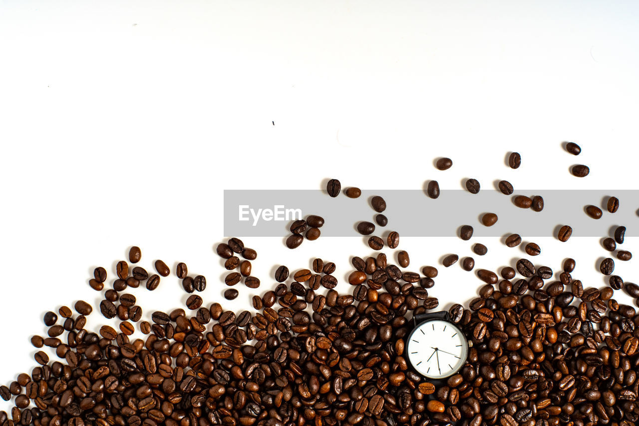 CLOSE-UP OF COFFEE BEANS ON TABLE