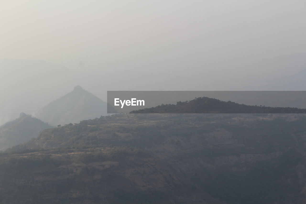 MOUNTAINS AGAINST SKY