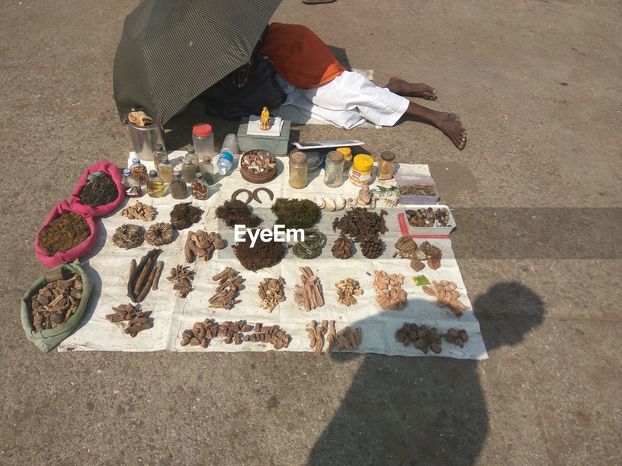High angle view of man selling spices