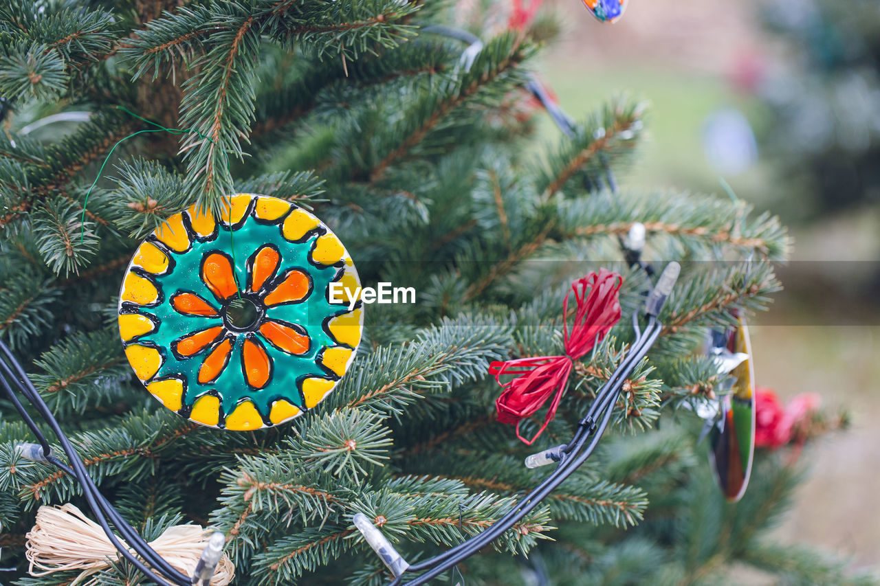 Handmade eco friendly decoration made of old cd or dvd discs on a christmas tree. diy ideas. recycle