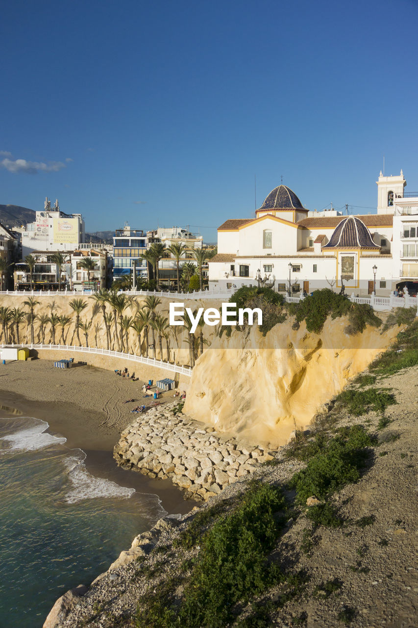 Old town beach and church of san jaime and santa ana, benidorm, alicante, spain