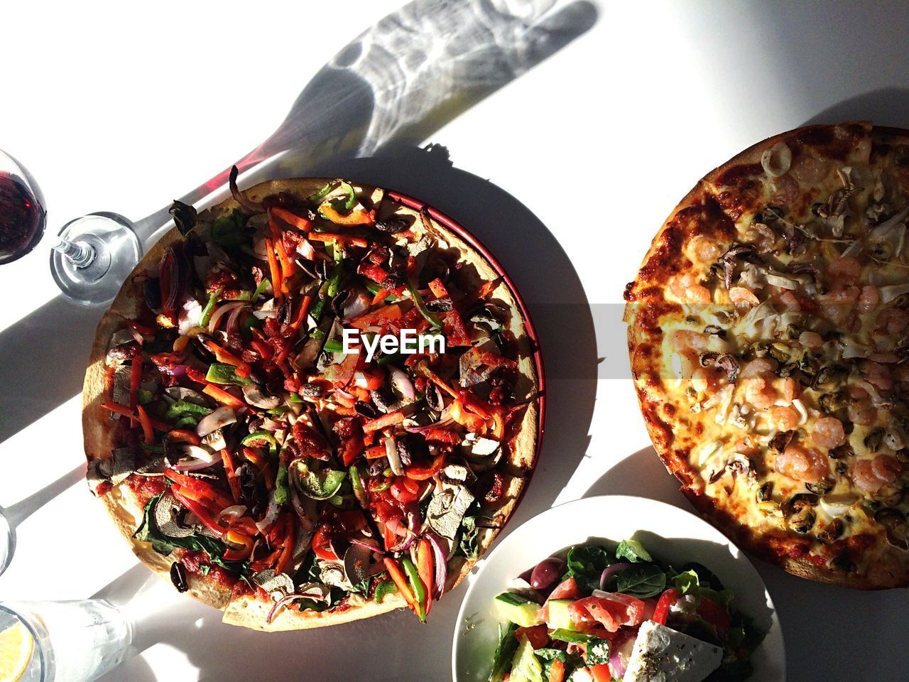 High angle view of pizzas served on table