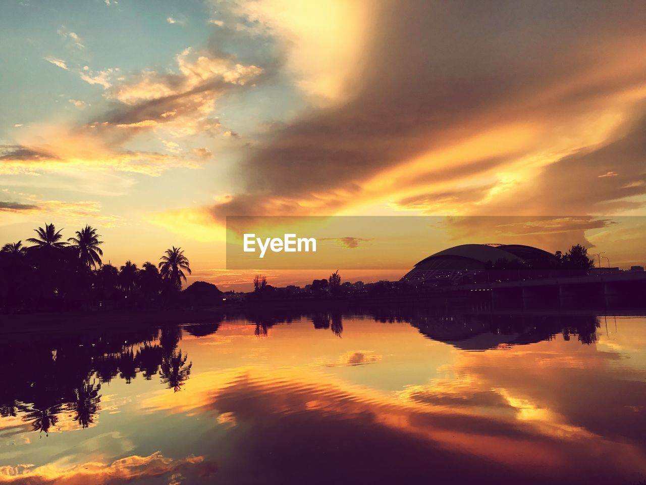 Scenic view of lake against sky during sunset