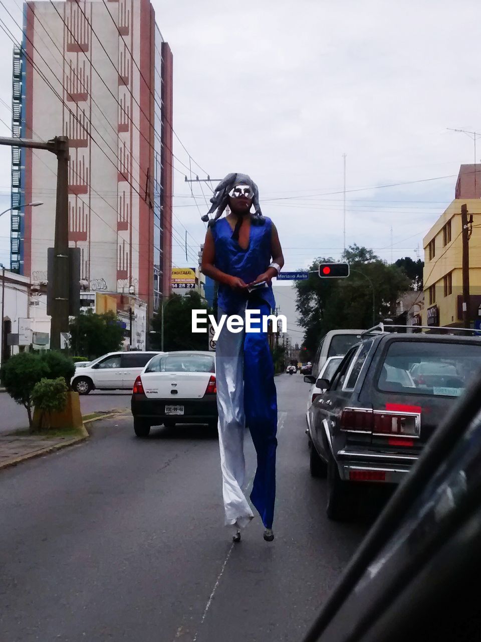 WOMAN WALKING ON CITY STREET