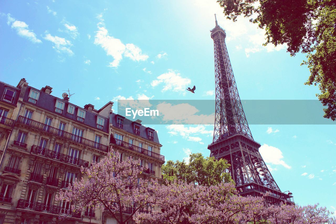 Low angle view of eiffel tower against sky in city