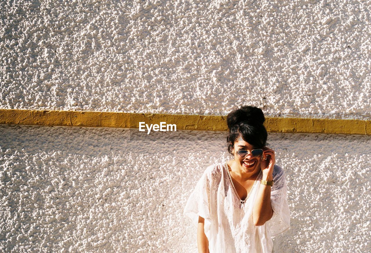 Young woman in sunglasses at beach 