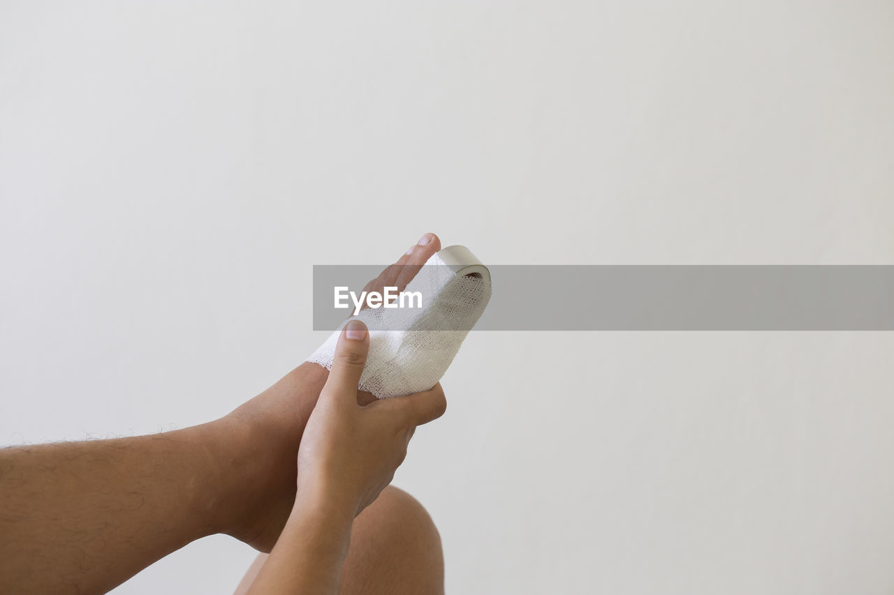 Big toe foot after accident on white background.