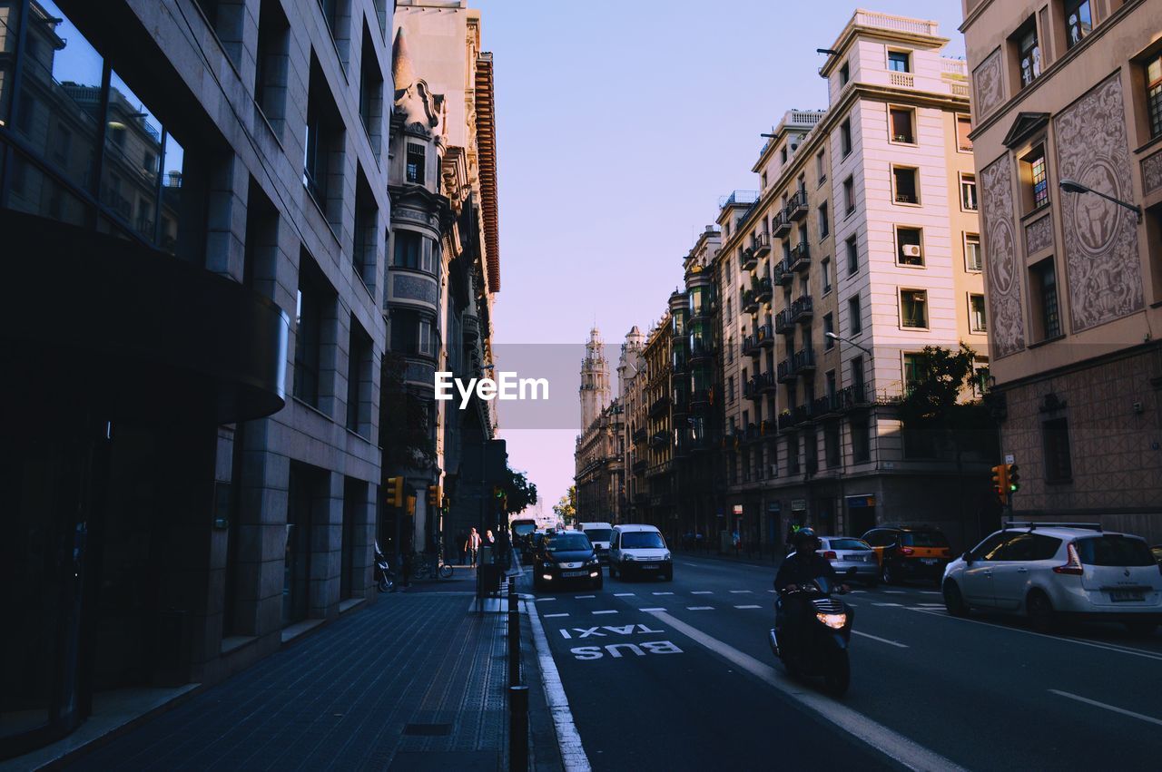 Road amidst buildings in city