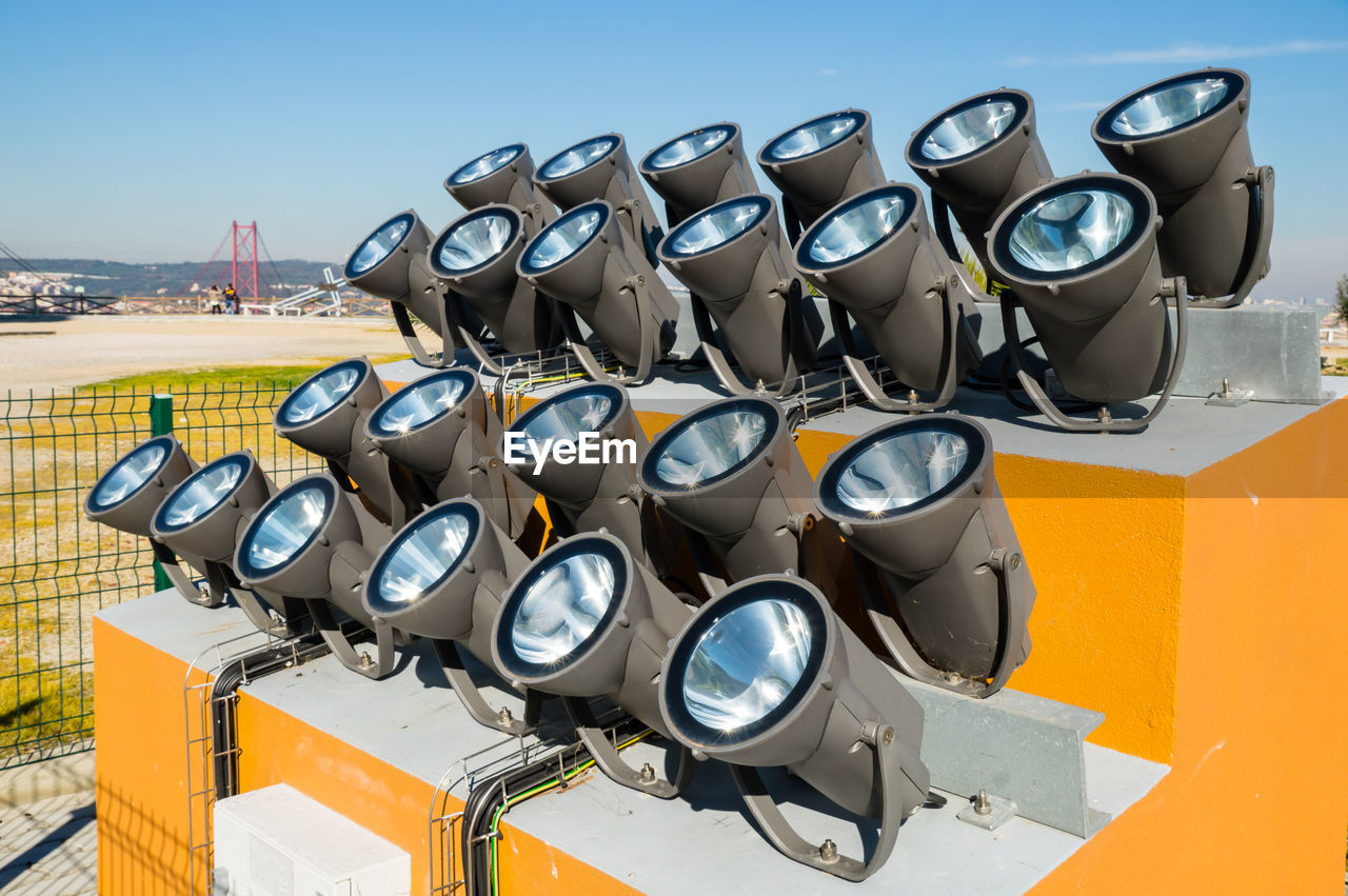 CLOSE-UP OF PIPES ON WALL AGAINST SKY