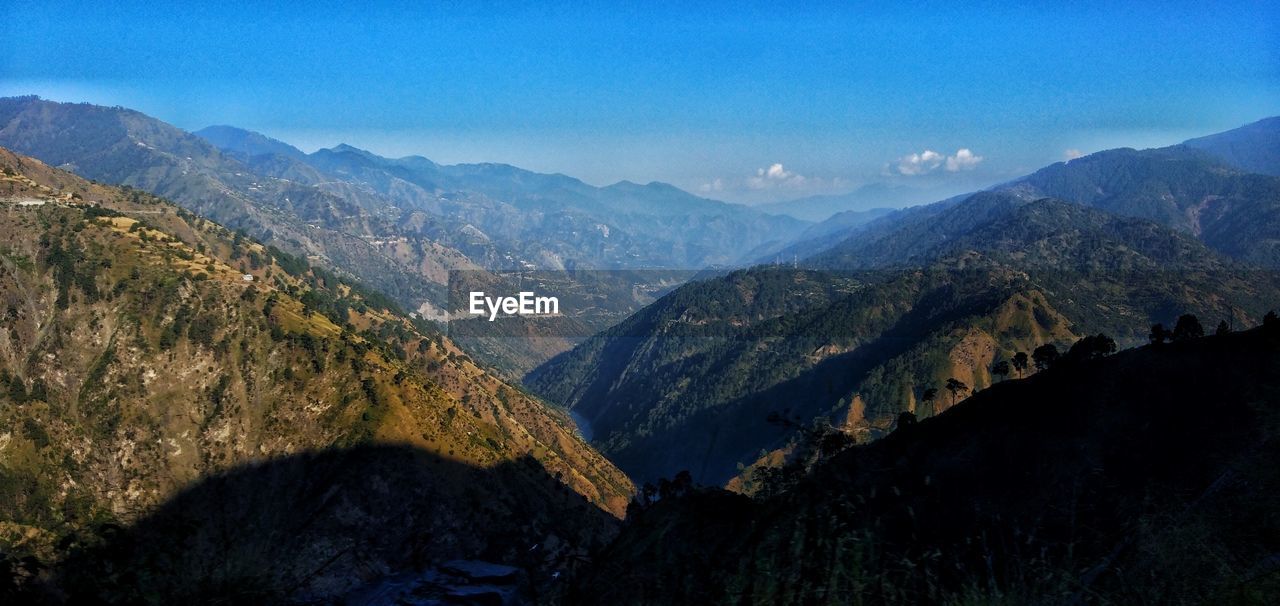 SCENIC VIEW OF VALLEY AGAINST SKY