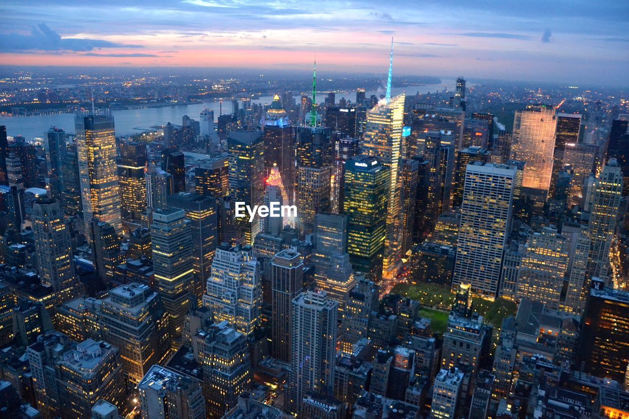 High angle view of illuminated cityscape at dusk