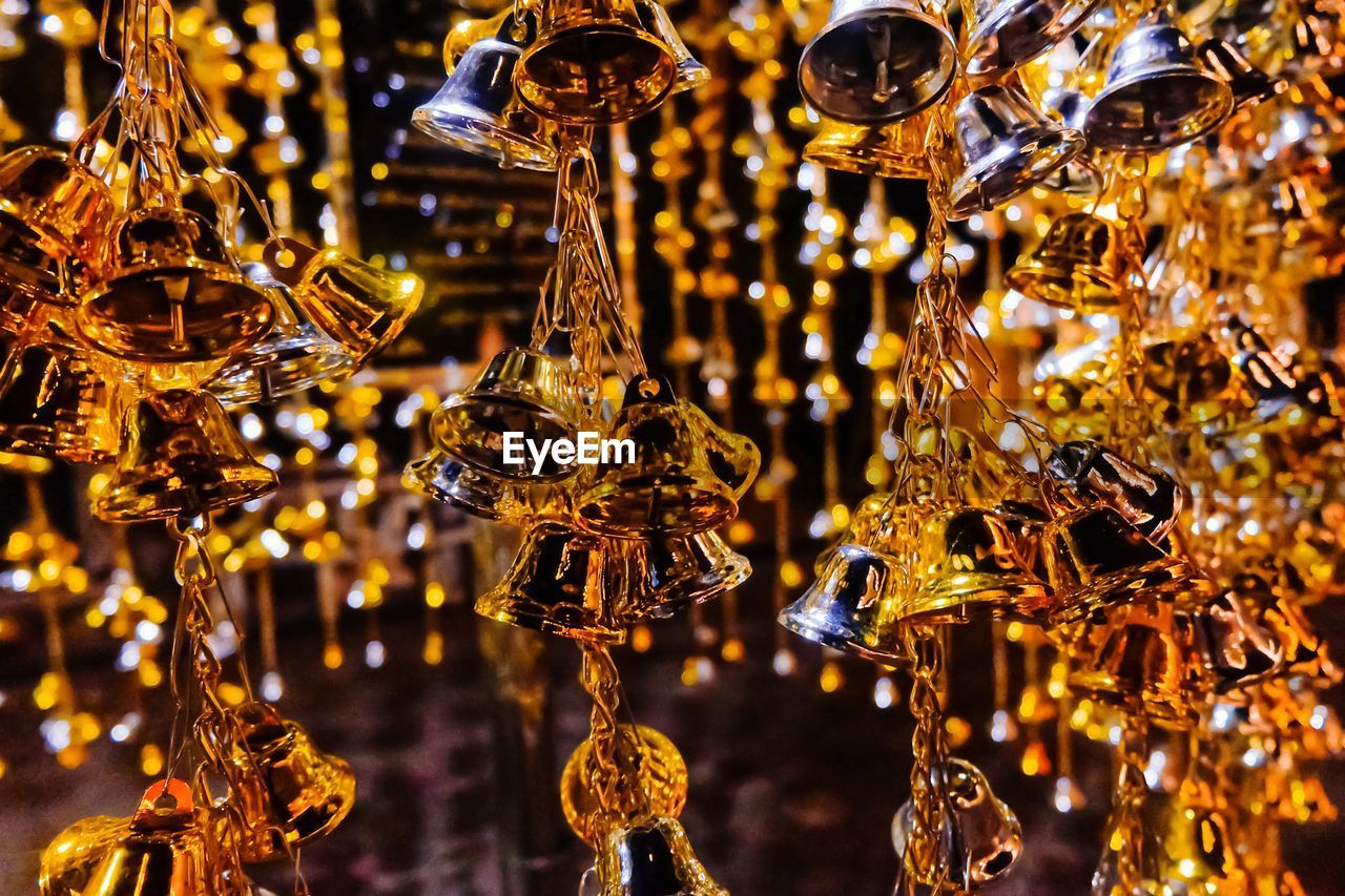 Close-up of golden wind chimes chandelier