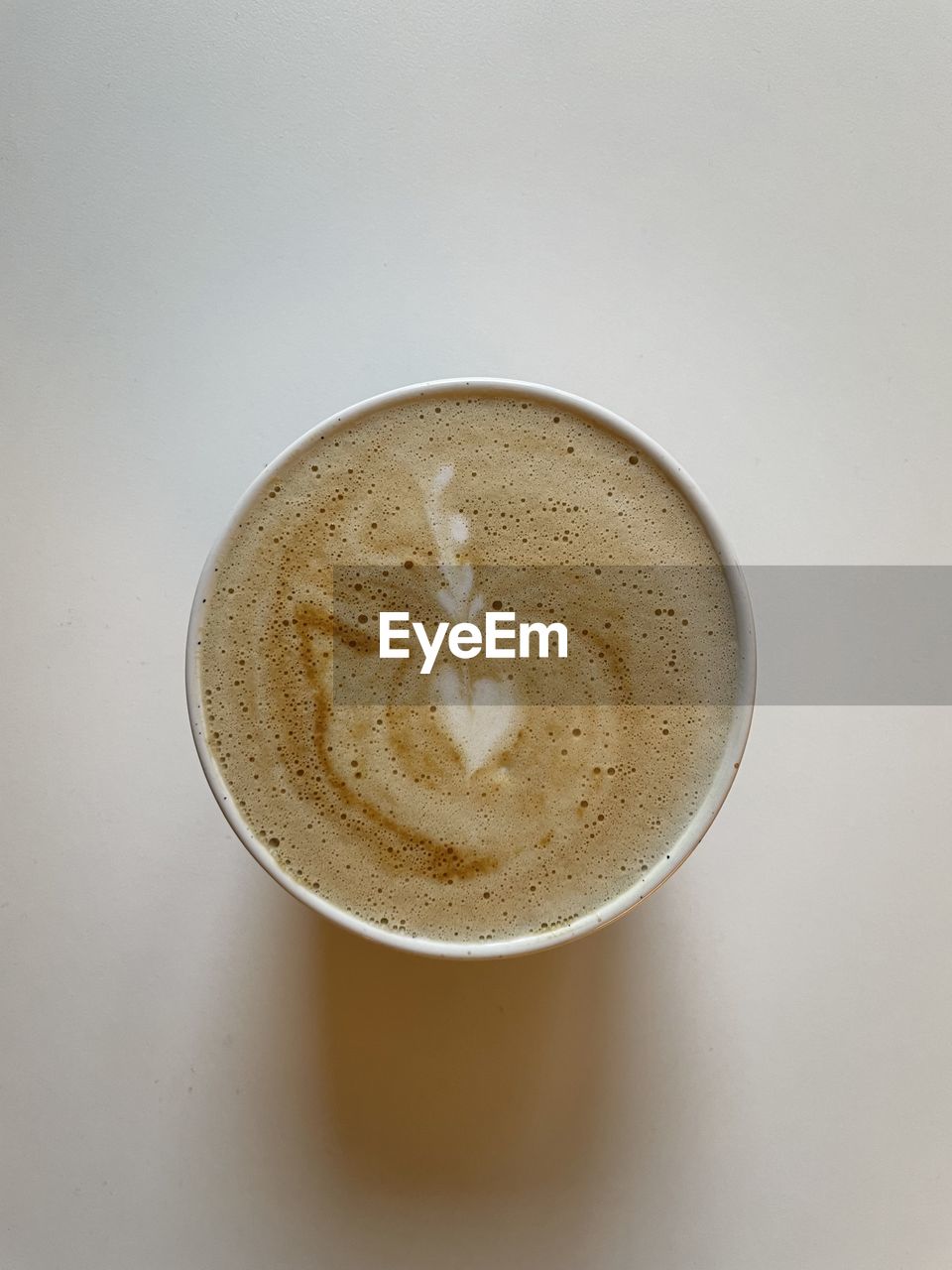 drink, food and drink, refreshment, coffee, still life, indoors, cup, mug, coffee cup, directly above, frothy drink, no people, close-up, freshness, table, latte, hot drink, food, high angle view, shape, studio shot