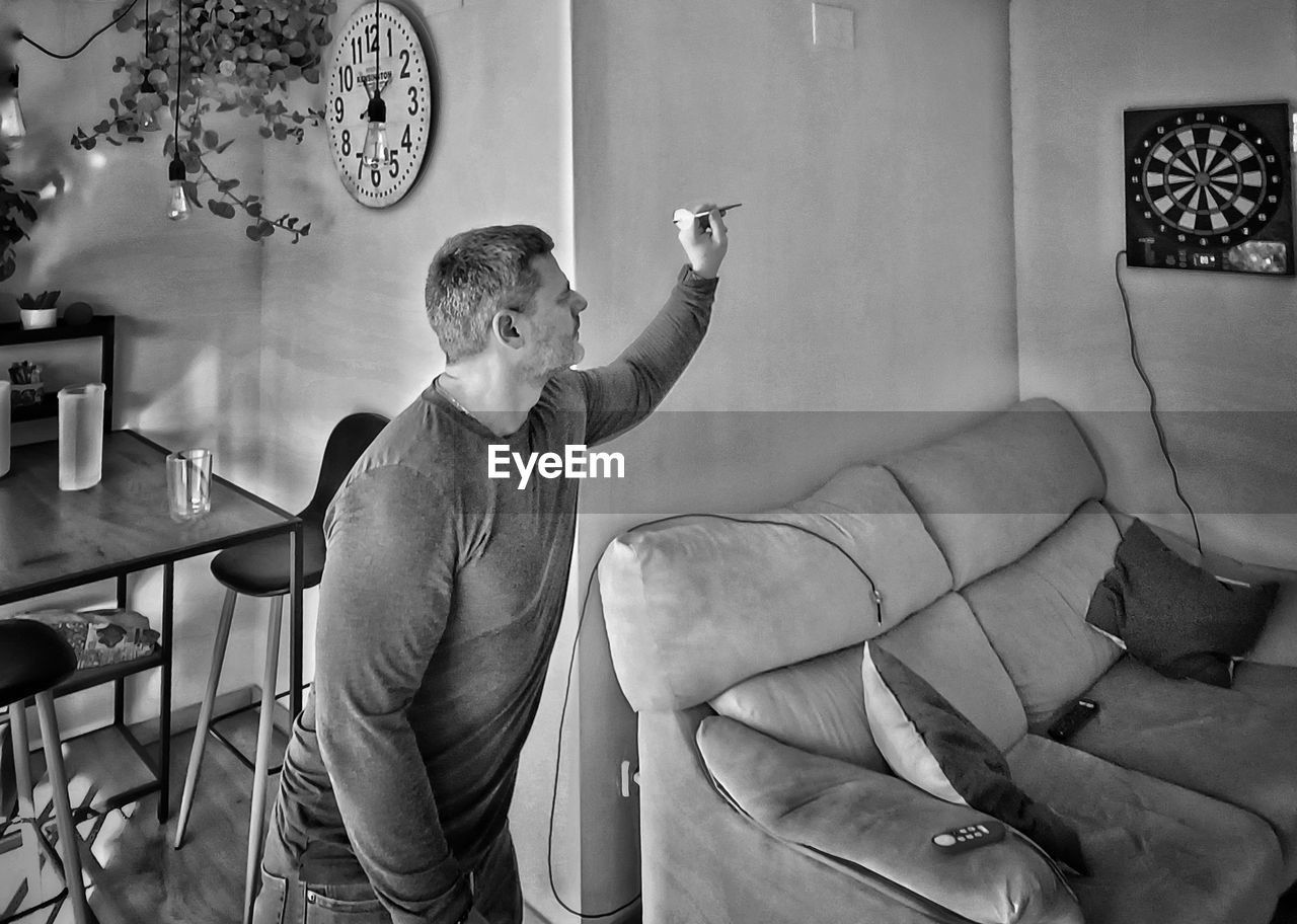 Portrait of young man sitting on chair