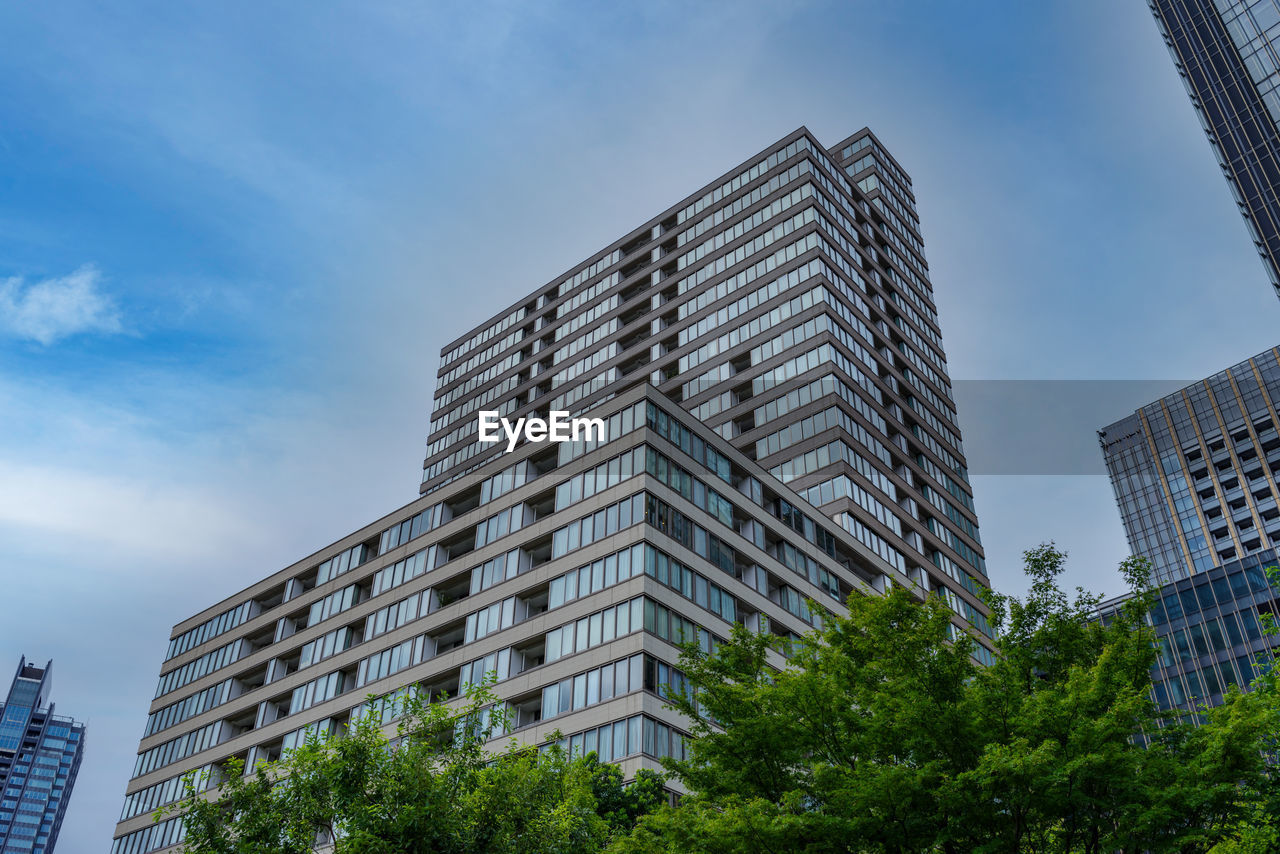 Low angle view of modern buildings against sky