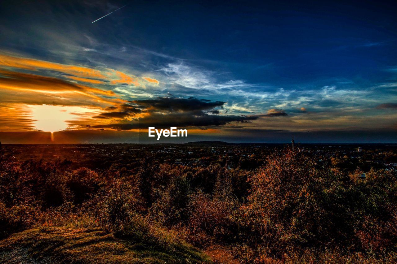 SCENIC VIEW OF DRAMATIC SKY DURING SUNSET