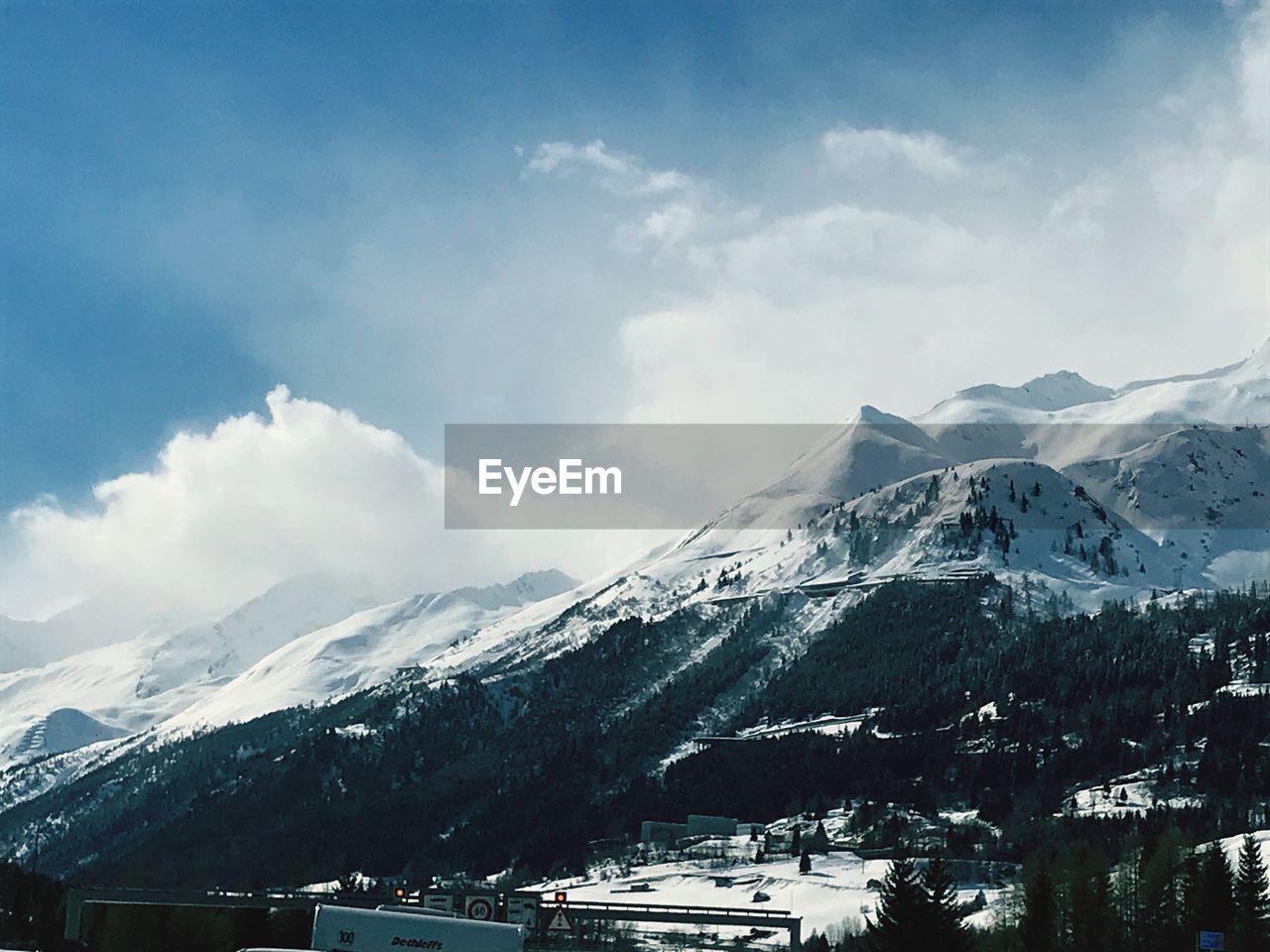 Scenic view of snowcapped mountains against sky