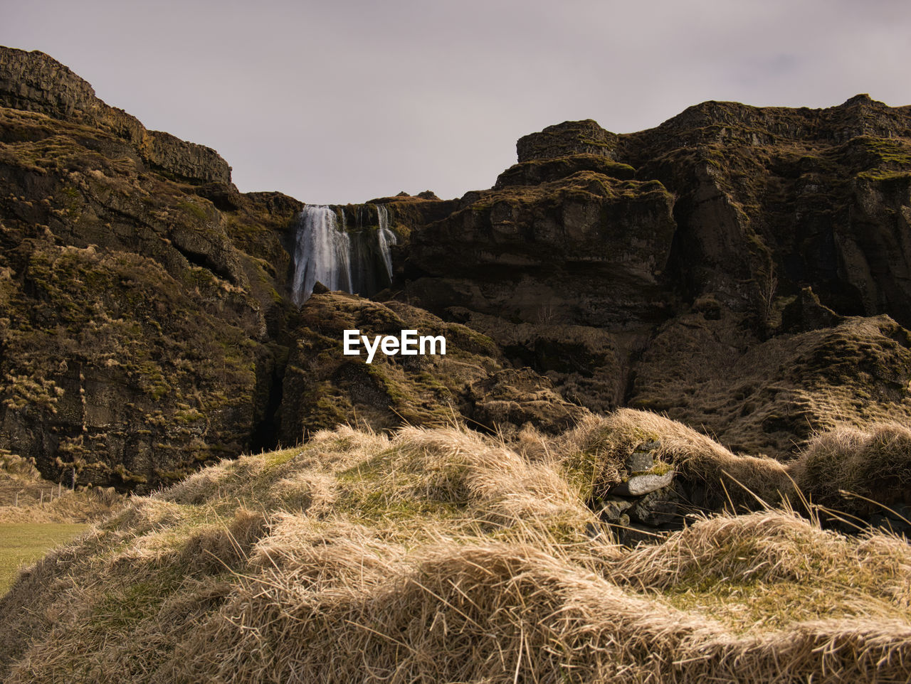 LOW ANGLE VIEW OF ROCK FORMATION ON LAND AGAINST SKY