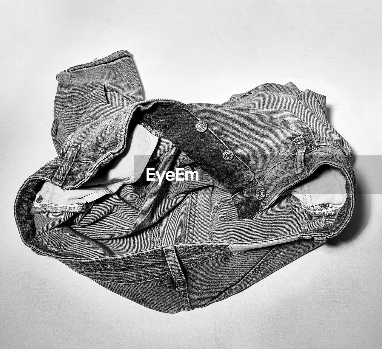 Close-up of jeans over gray background