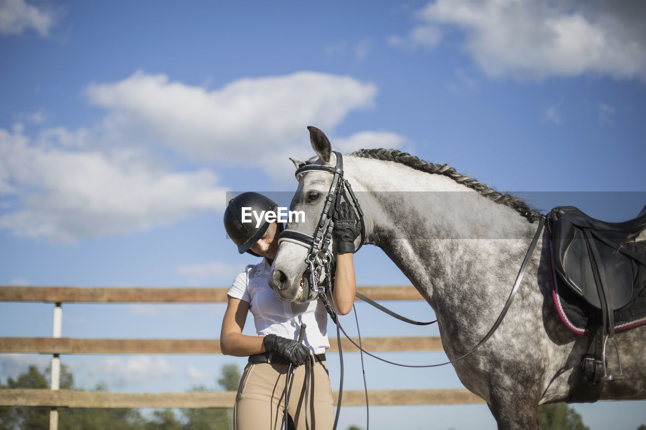 View of a woman with a horse