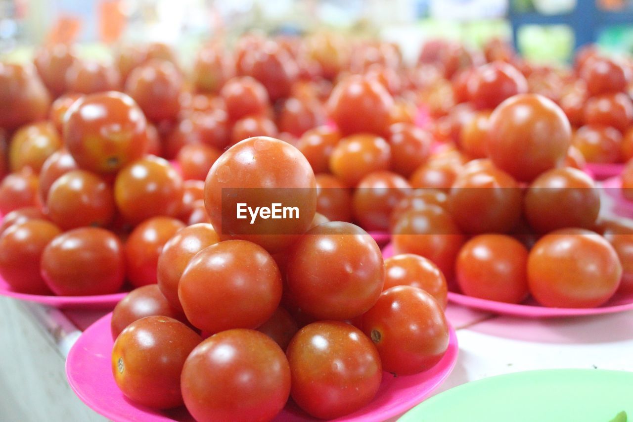 Close-up of tomatoes in plate at market
