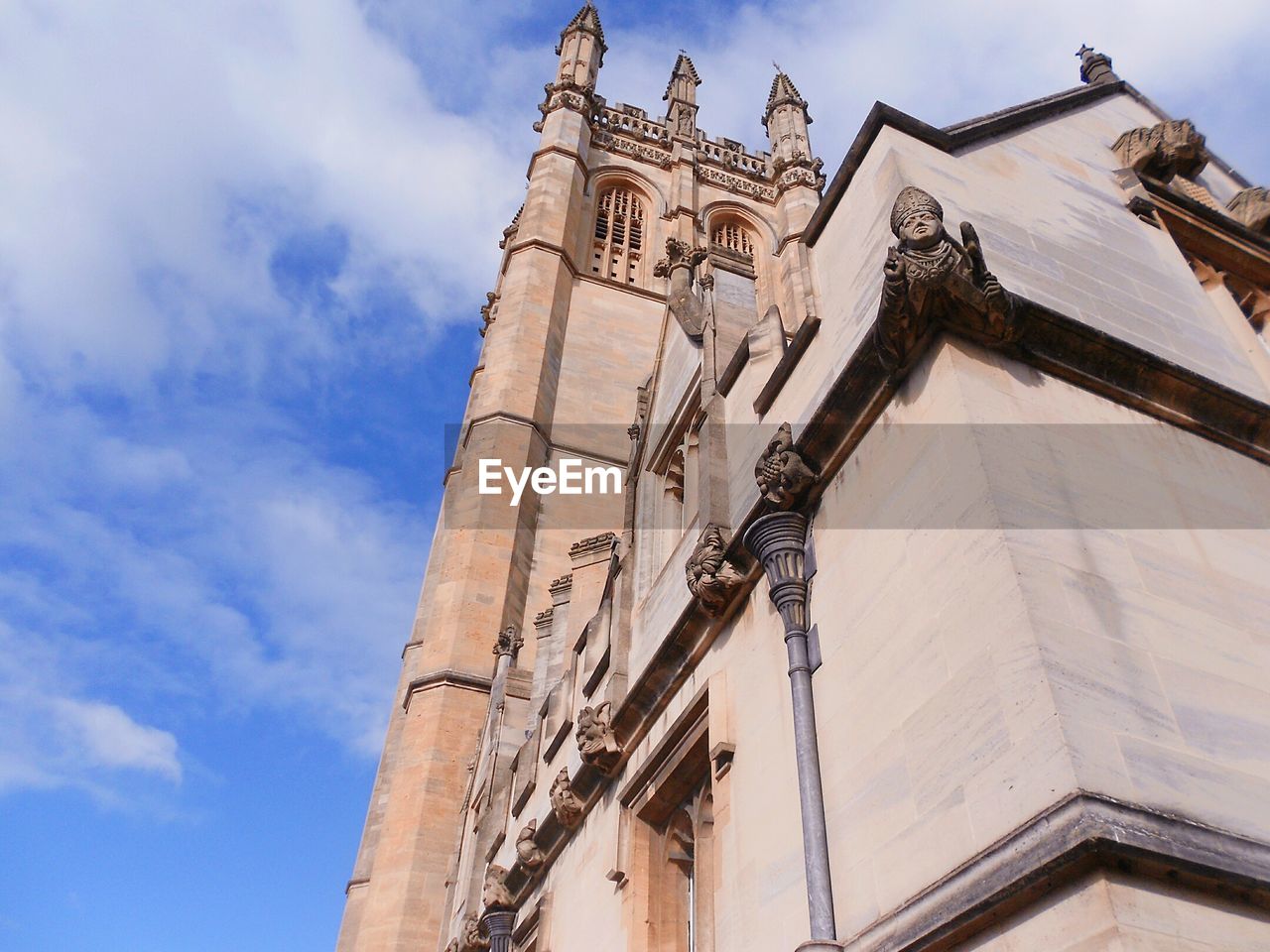 Low angle view of bell tower against sky