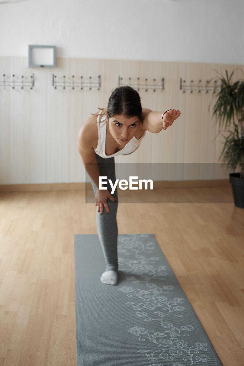 Group of women practicing pilates exercises in class