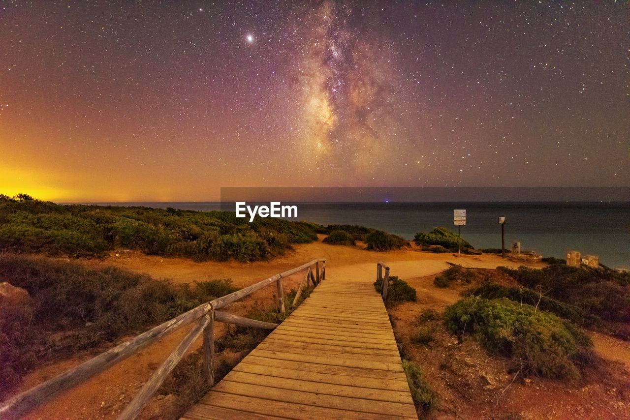 Scenic view of sea against sky at night