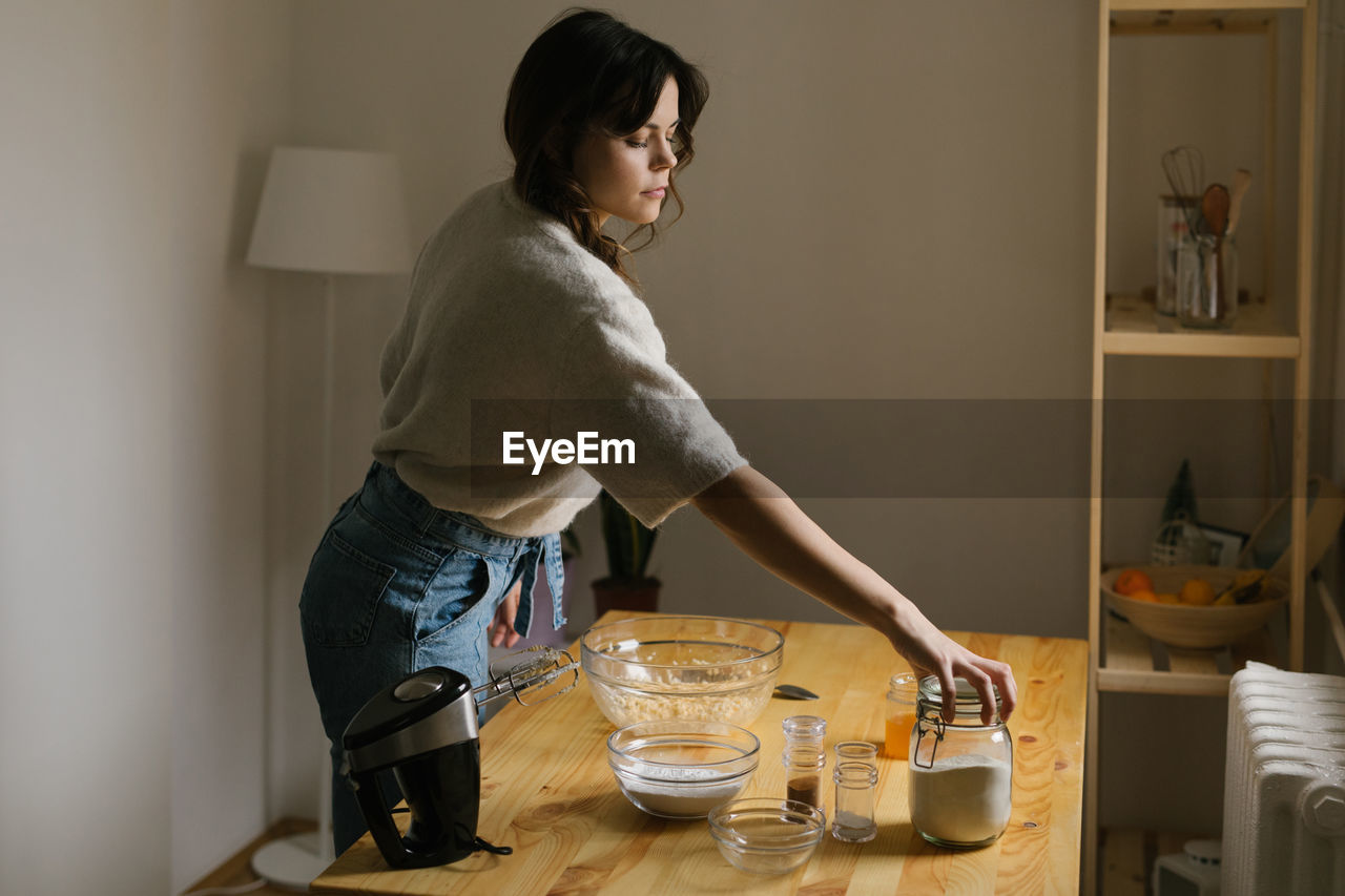 Young woman making christmas cookies