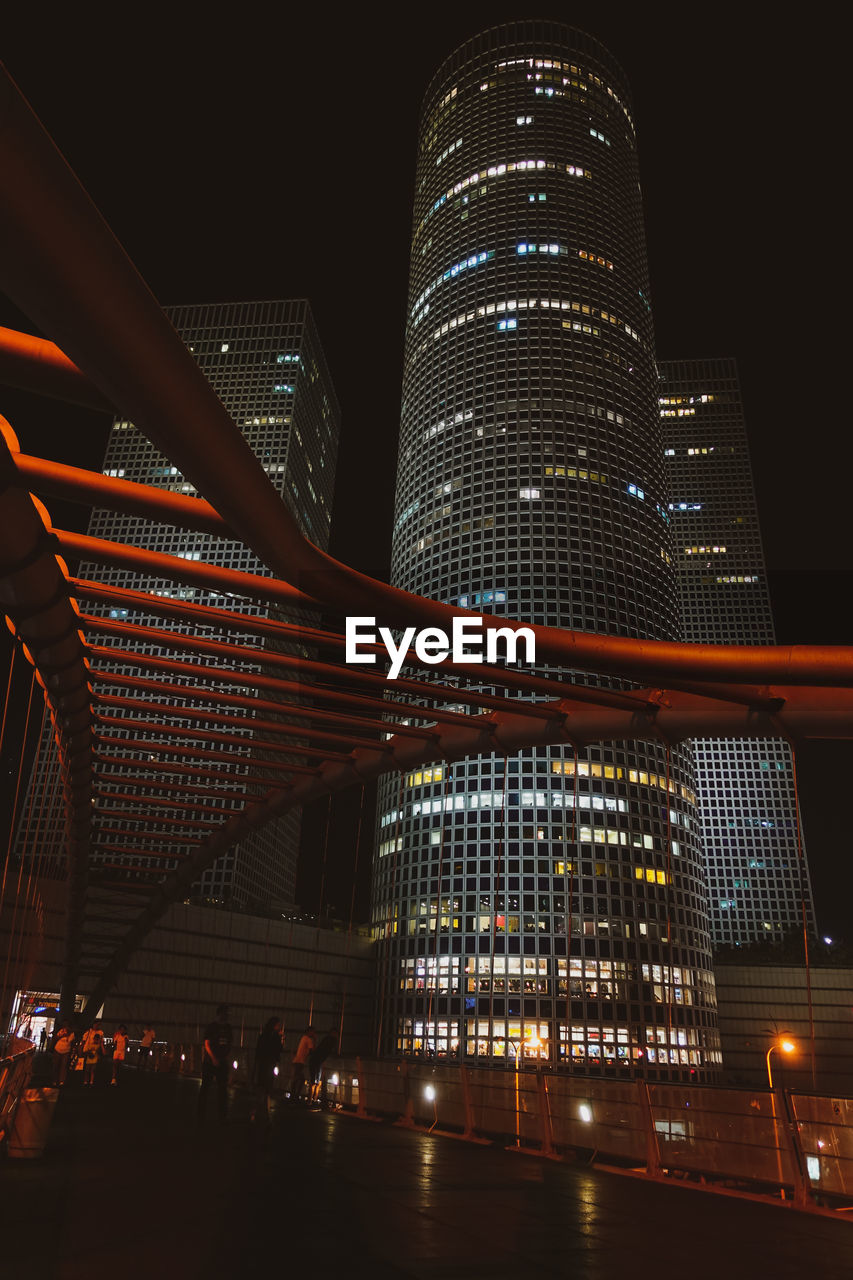 Low angle view of illuminated buildings at night