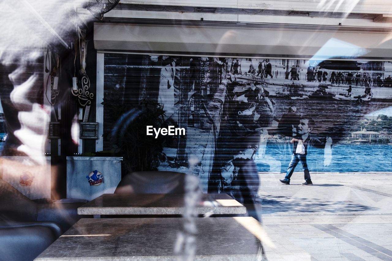 PEOPLE WALKING IN BUILDING BY CITY