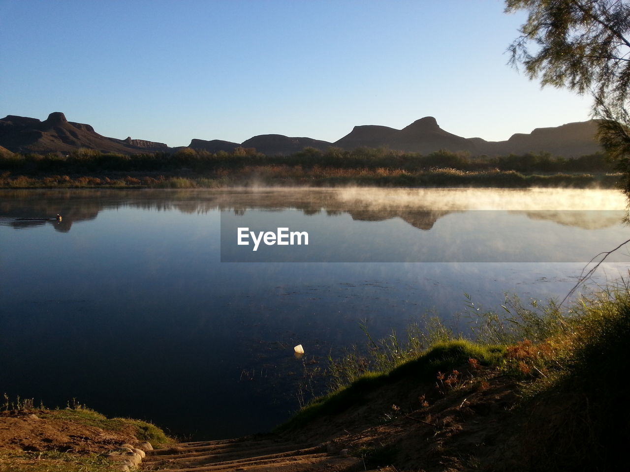 Scenic view of lake against clear sky