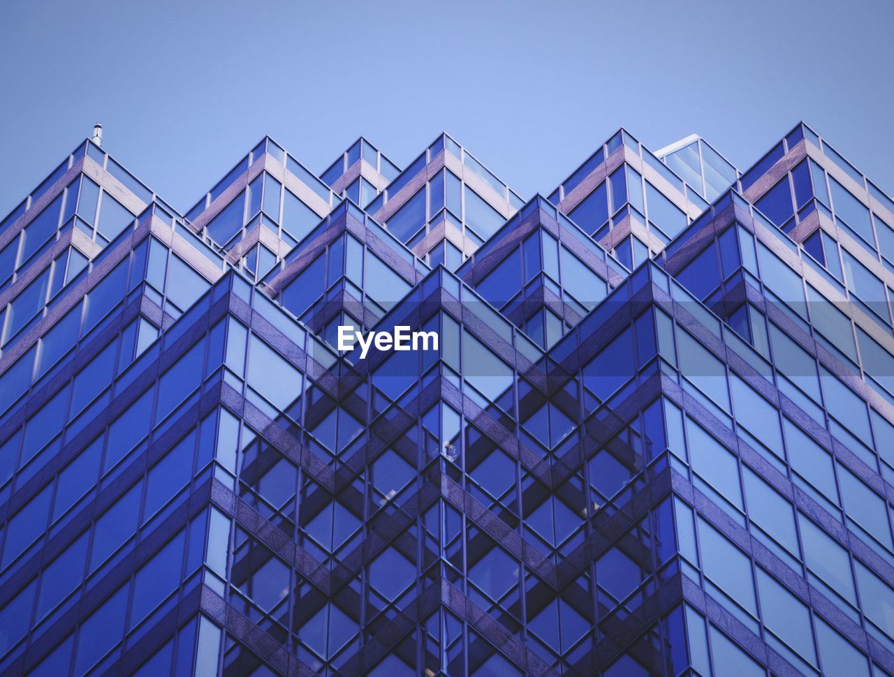 Low angle view of modern building against clear sky