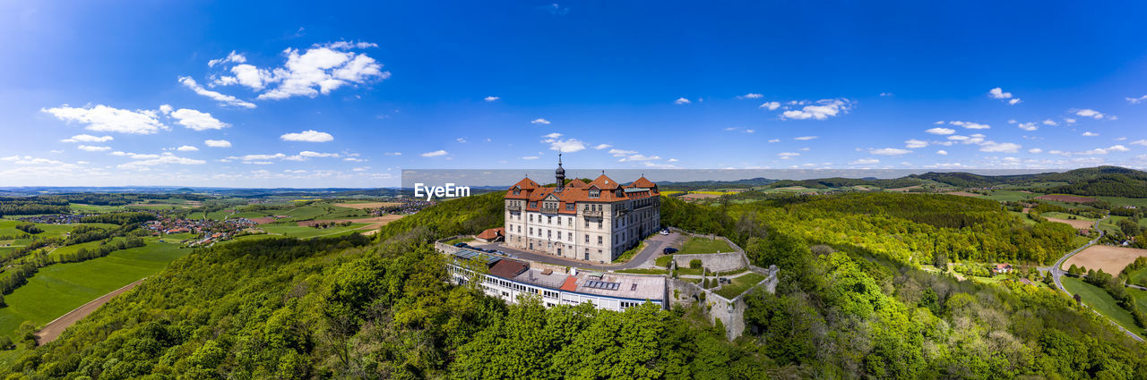 Germany, hesse, hofbieber, helicopter view of bieberstein palace on sunny autumn day