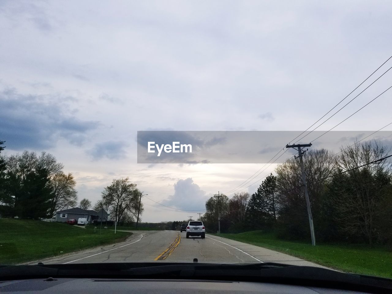 CARS ON STREET SEEN THROUGH WINDSHIELD