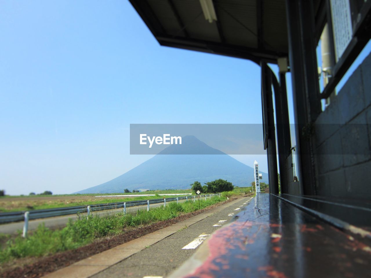 Road by mountain against clear sky