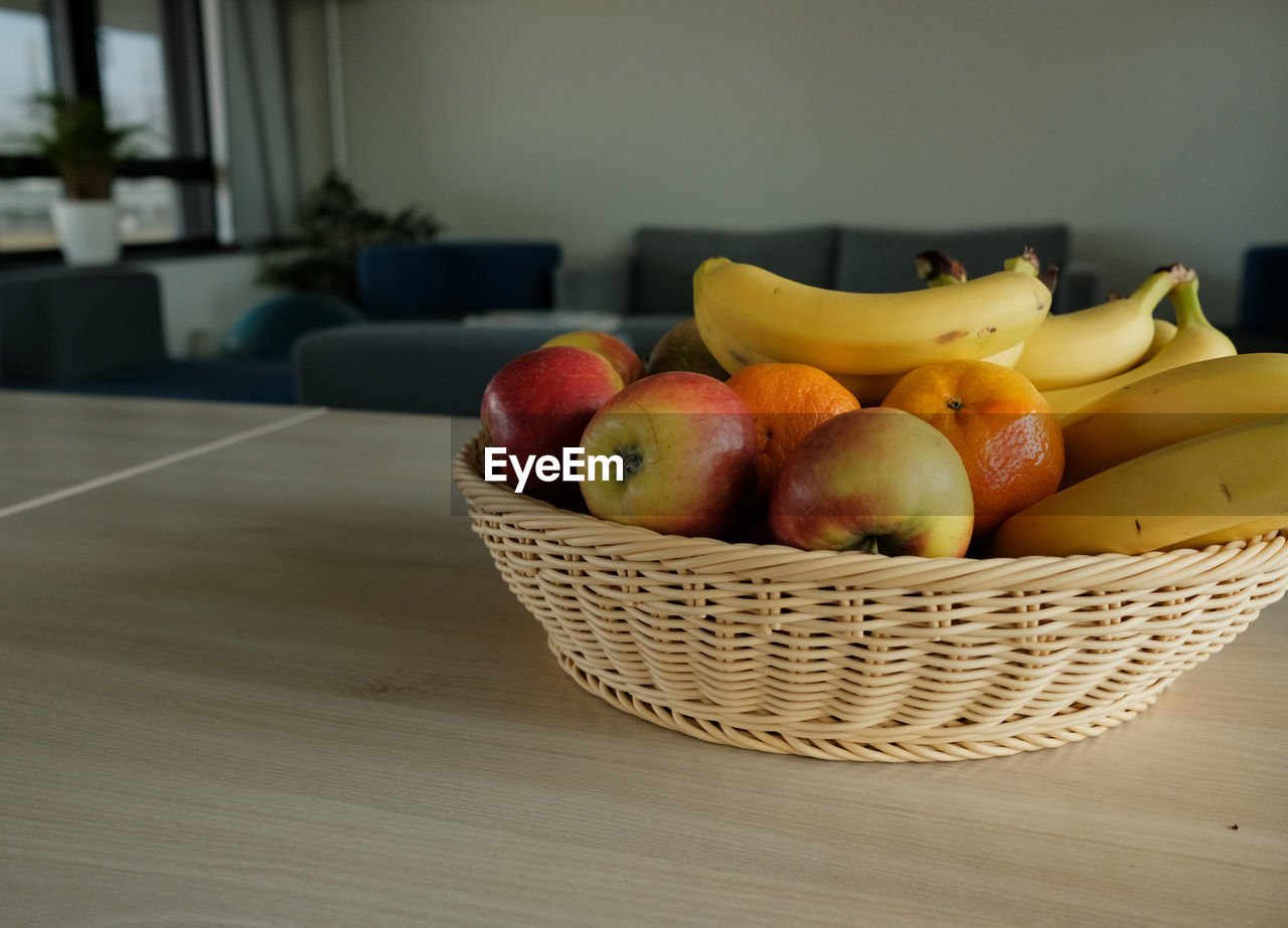 basket, healthy eating, fruit, food and drink, food, wellbeing, freshness, container, wicker, indoors, plant, table, apple - fruit, no people, produce, yellow, still life, banana, apple, bowl, wood, still life photography