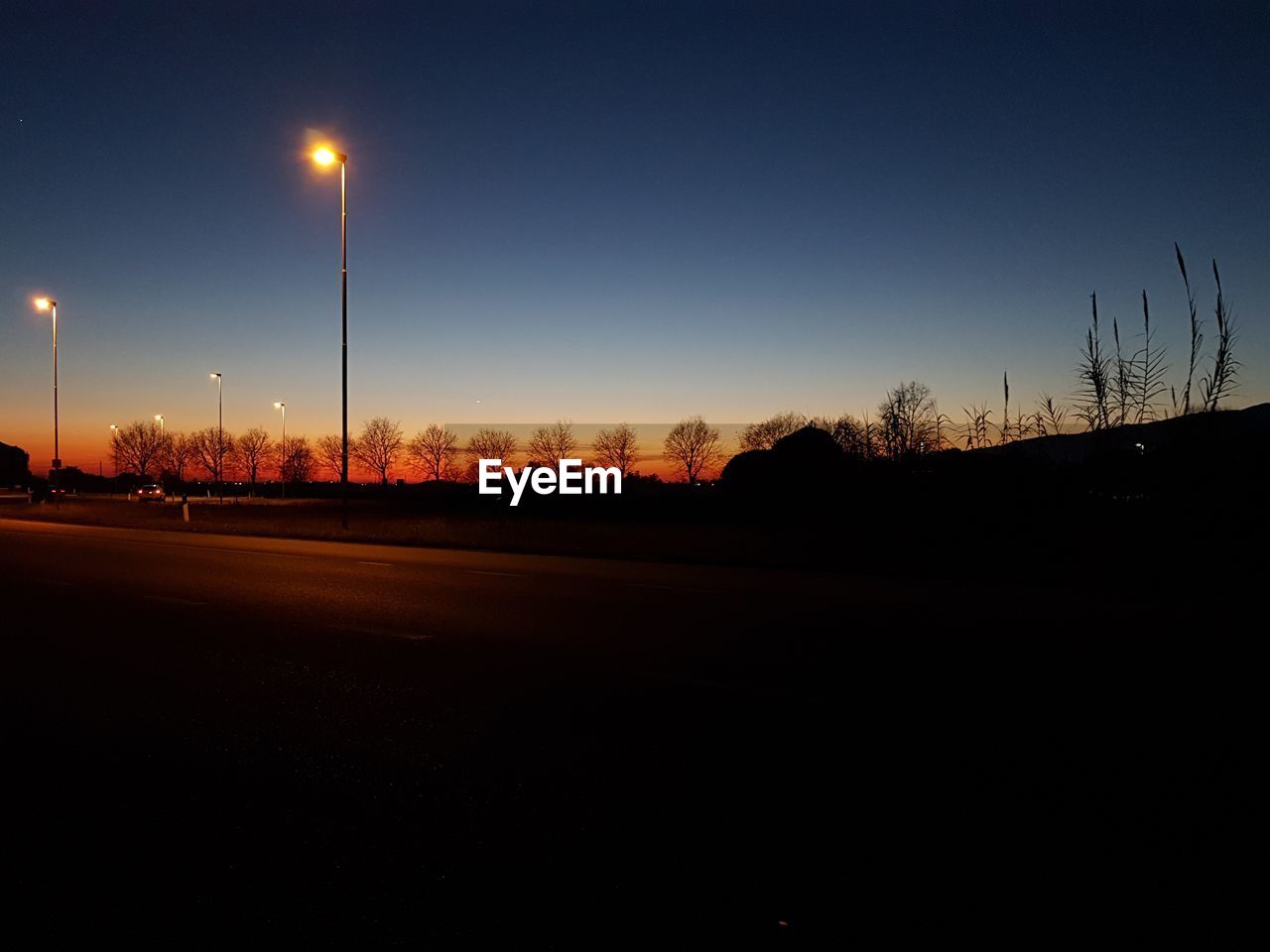 SILHOUETTE OF STREET AT NIGHT