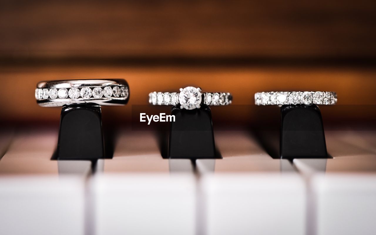 Close-up of diamond rings on piano