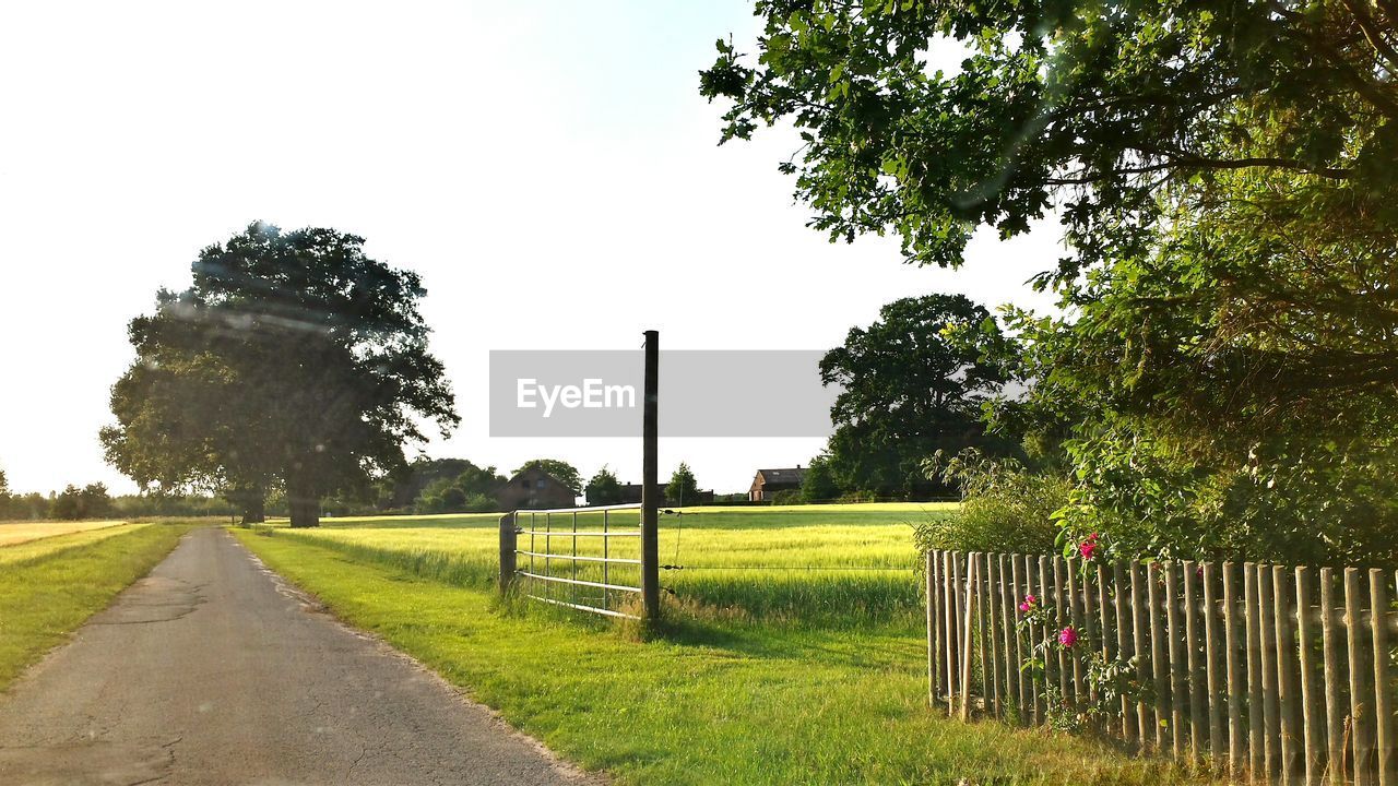 Empty road along countryside landscape