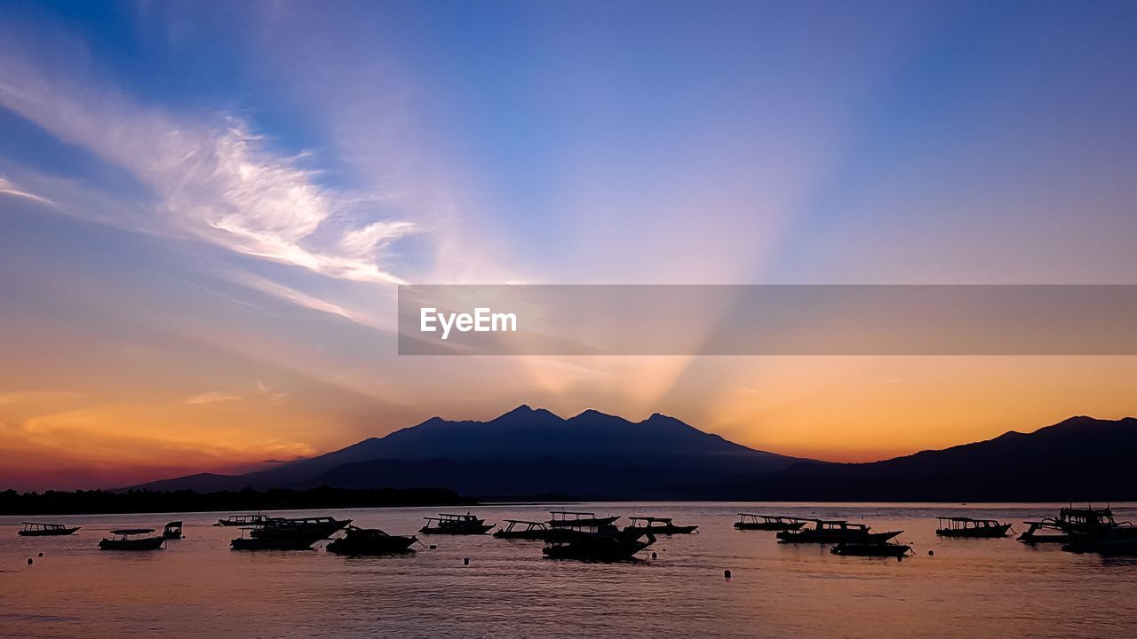 Scenic view of sea against sky at sunset